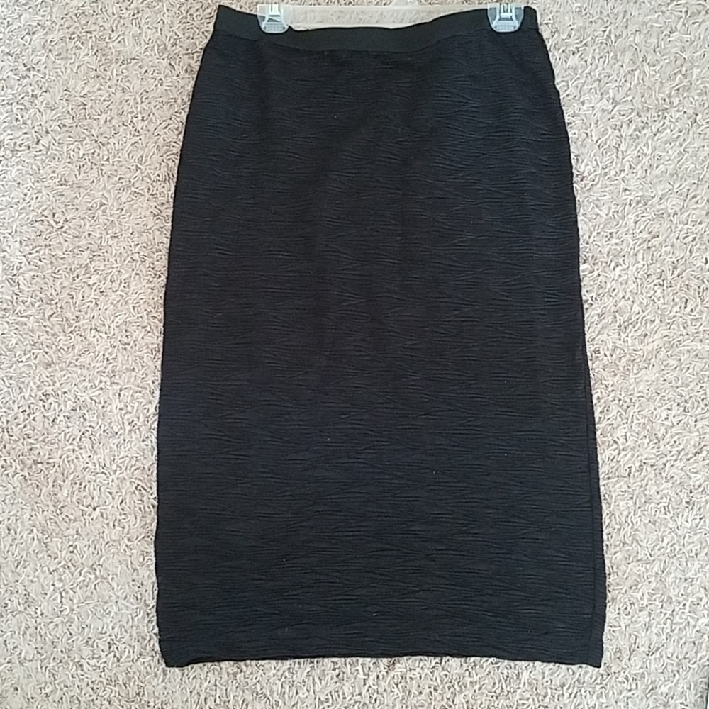 Not your average black textured pencil skirt.